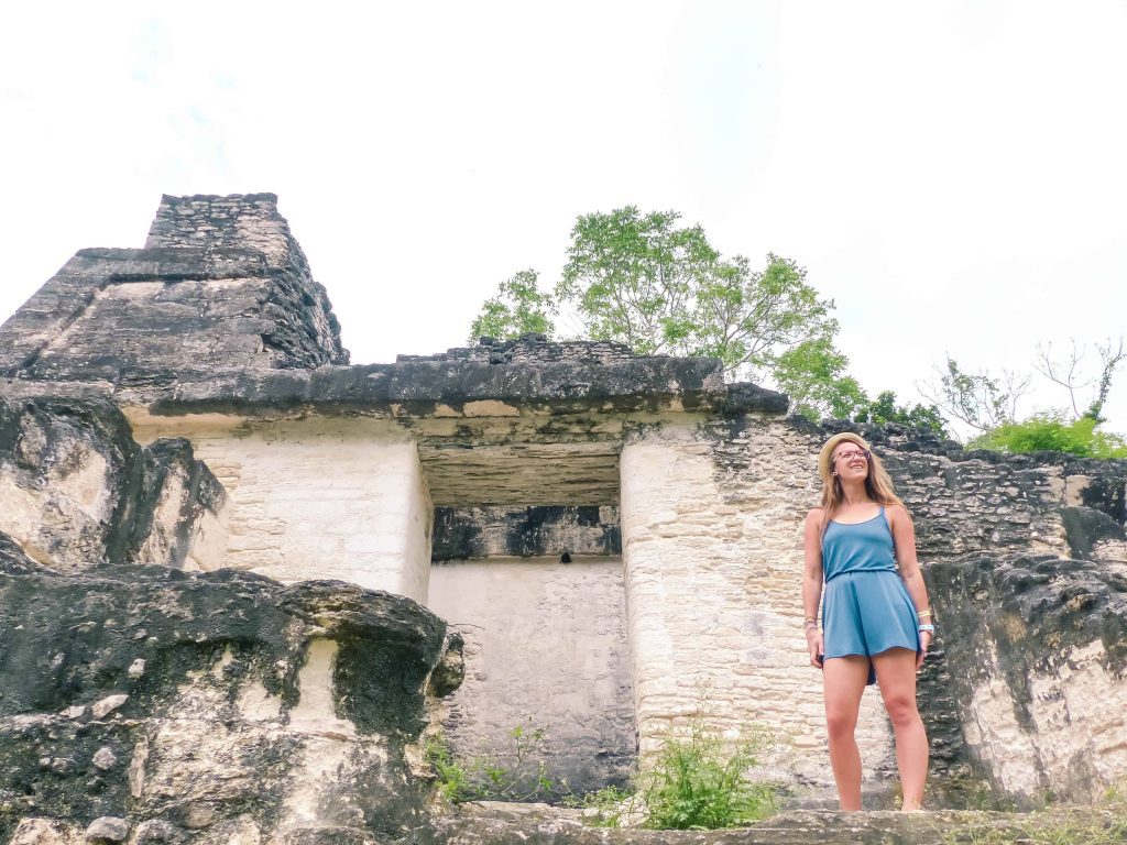 standing in guatemala national parks looking out over tikal in guatemala