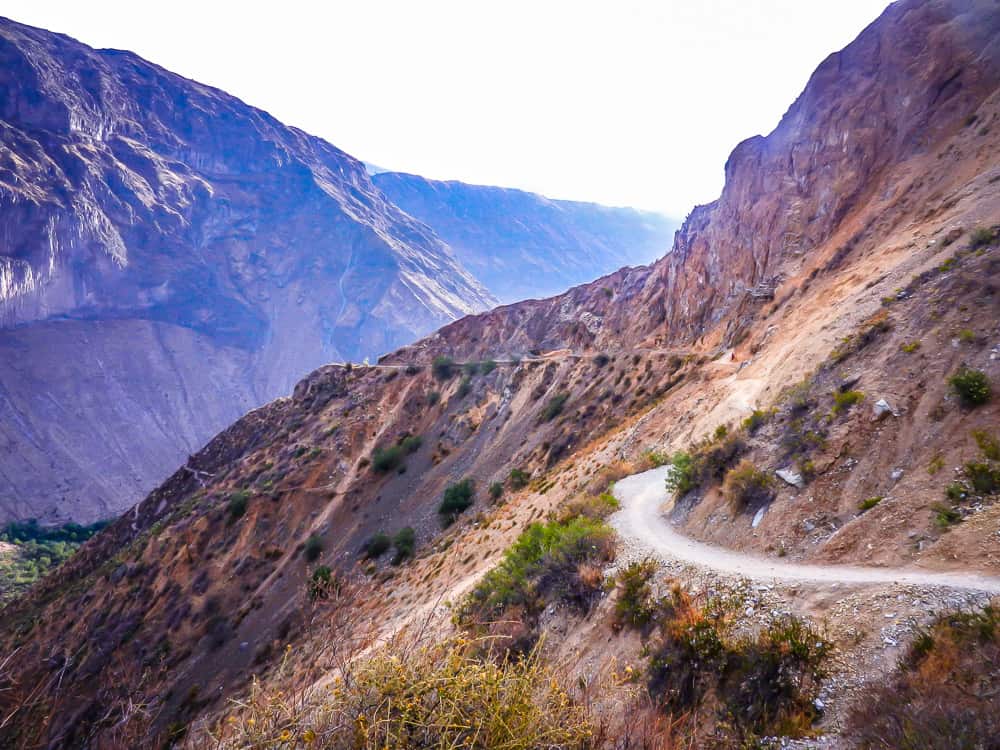 hiking down colca canyon in peru